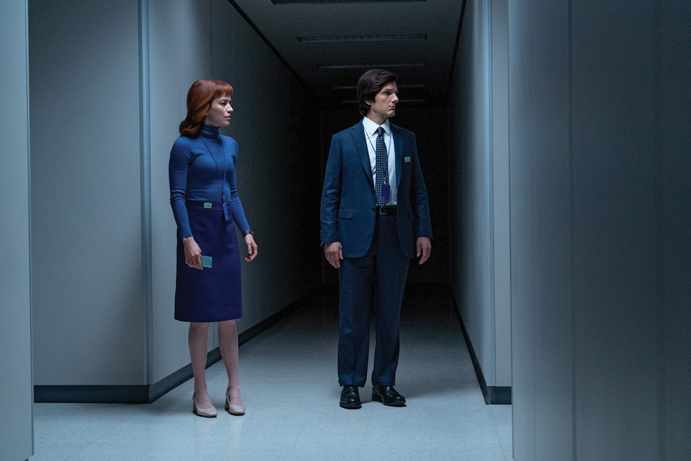 Mark S. (Adam Scott) and Helly R. (Britt Lower) stand in a hallway of the Severed floor of Lumon
