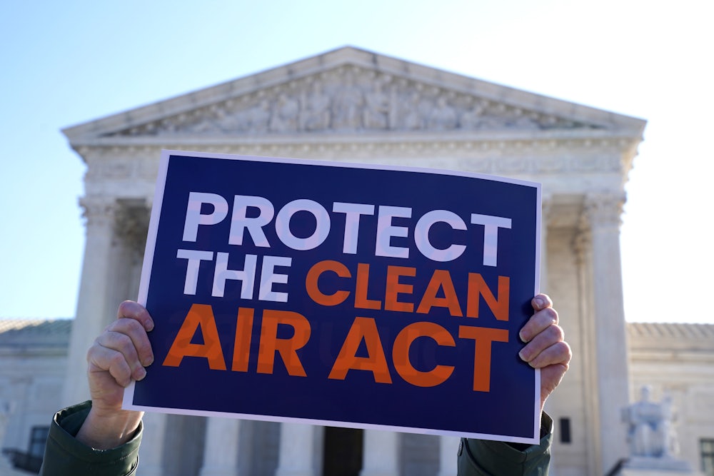 Climate activists rally outside as the Supreme Court in support of the Clean Air Act.