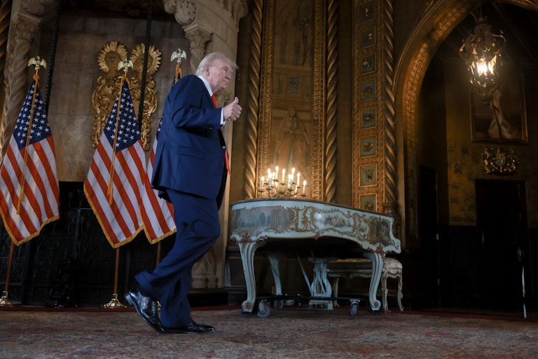Donald Trump gives a thumbs-up as he walks out of a press conference at Mar-a-Lago