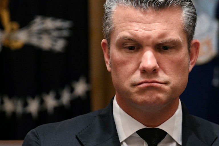 Defense Secretary Pete Hegseth looks down during a Trump Cabinet meeting