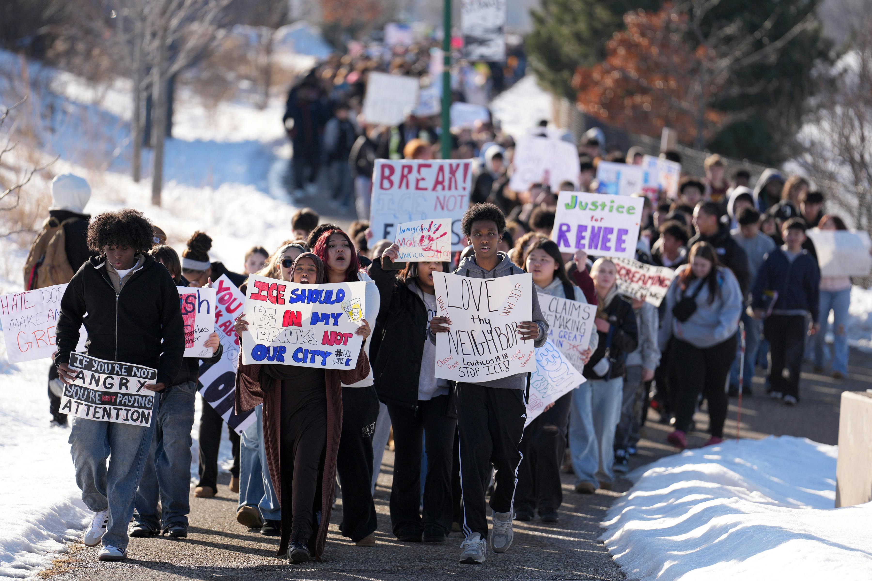 Students protest holding up signs like "Justice for Renee" and "ICE should be in my drinks not our city."