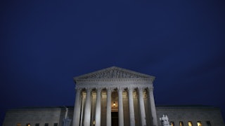 A view of the Supreme Court at dusk.