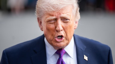 Donald Trump speaks to reporters outside the White House