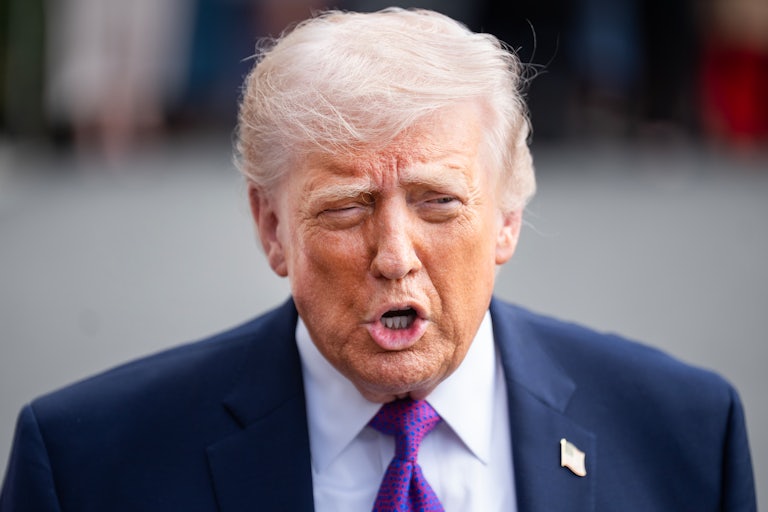 Donald Trump speaks to reporters outside the White House