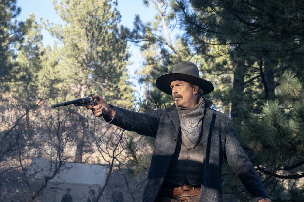Kevin Costner playing Hayes Ellison, pointing a gun and mounted on a horse, in “Horizon: An American Saga,” Chapter One