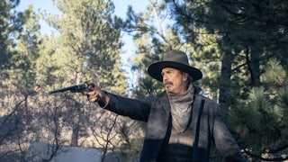 Kevin Costner playing Hayes Ellison, pointing a gun and mounted on a horse, in “Horizon: An American Saga,” Chapter One