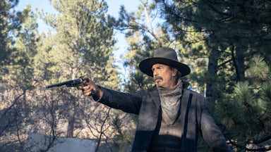 Kevin Costner playing Hayes Ellison, pointing a gun and mounted on a horse, in “Horizon: An American Saga,” Chapter One