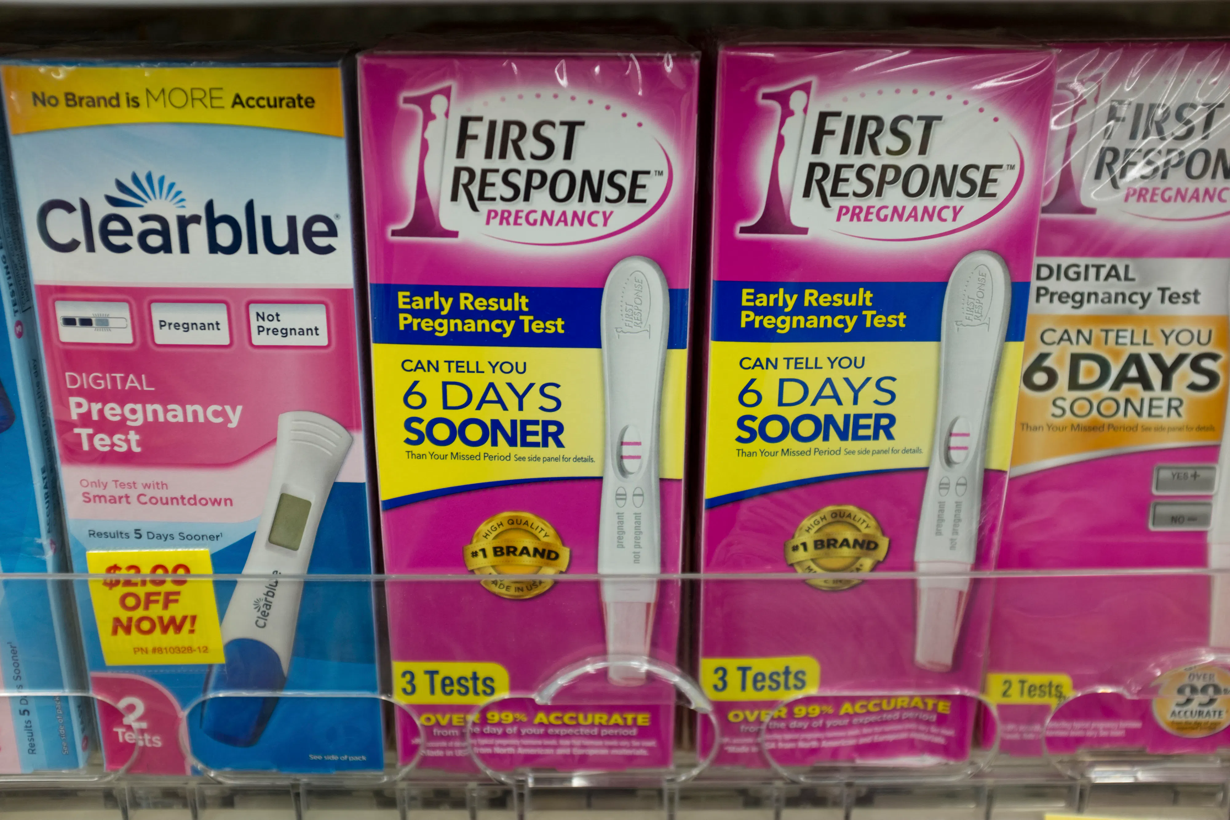 Pregnancy tests on a shelf in a pharmacy