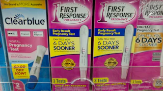 Pregnancy tests on a shelf in a pharmacy