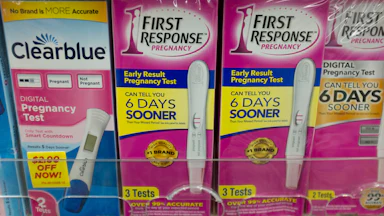 Pregnancy tests on a shelf in a pharmacy