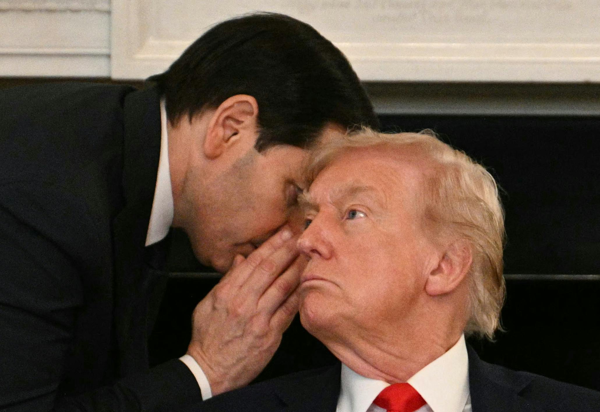 Marco Rubio whispers in Donald Trump's ear