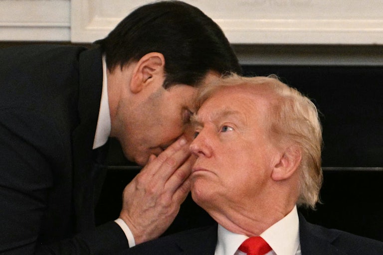 Marco Rubio whispers in Donald Trump's ear