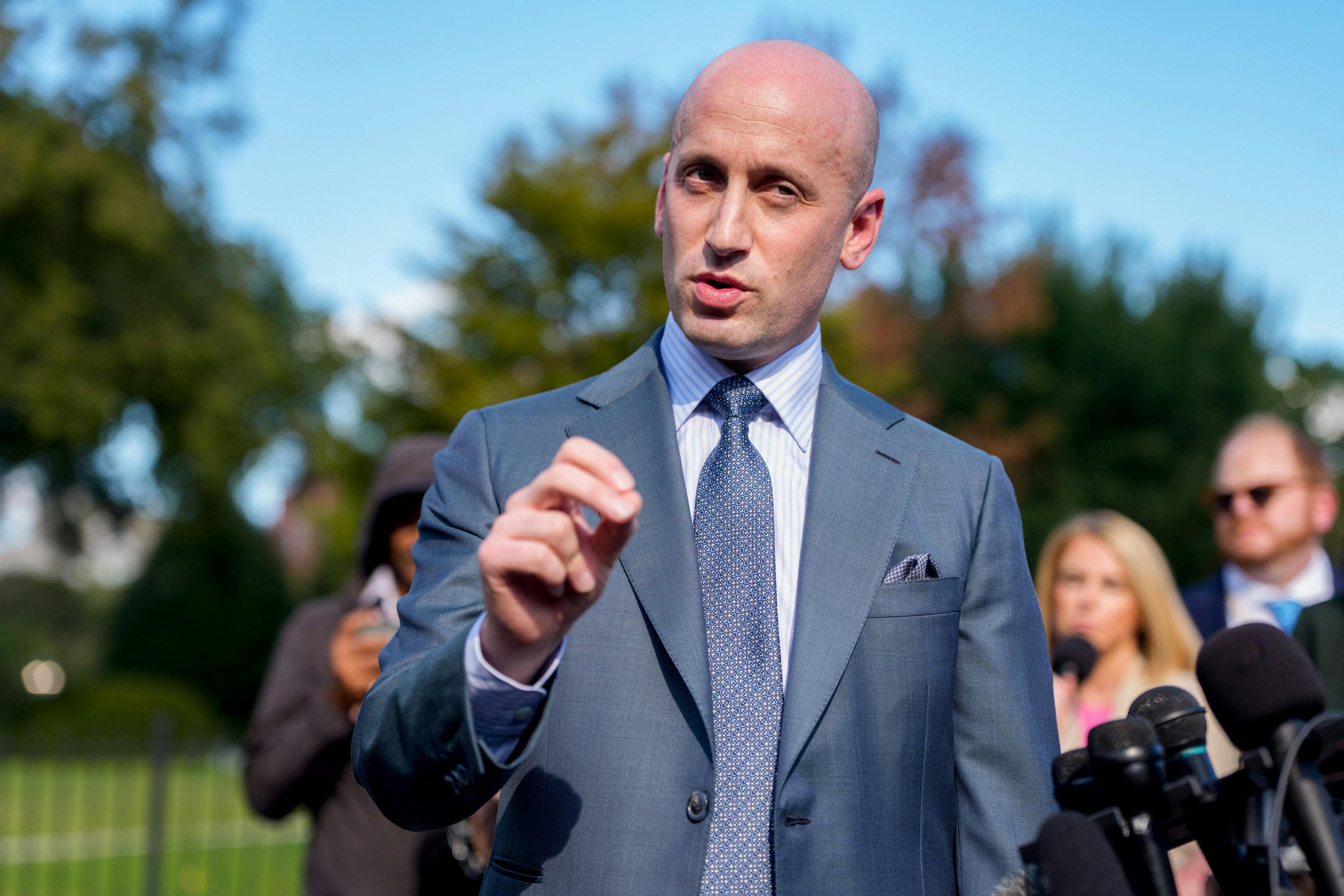 Stephen Miller speaks to reporters outside the White House.