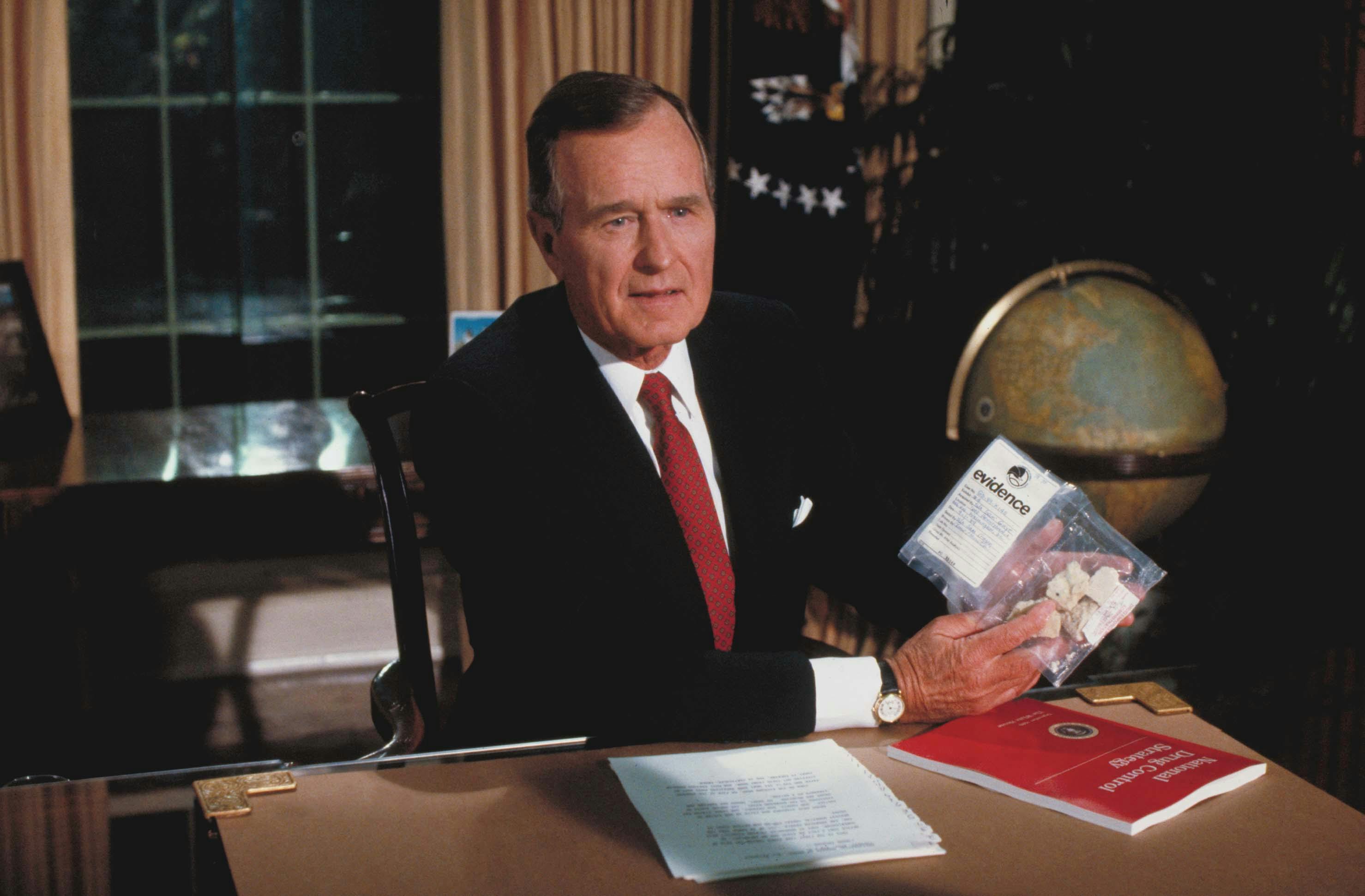 President George H.W. Bush holds a bag of crack that he bought.