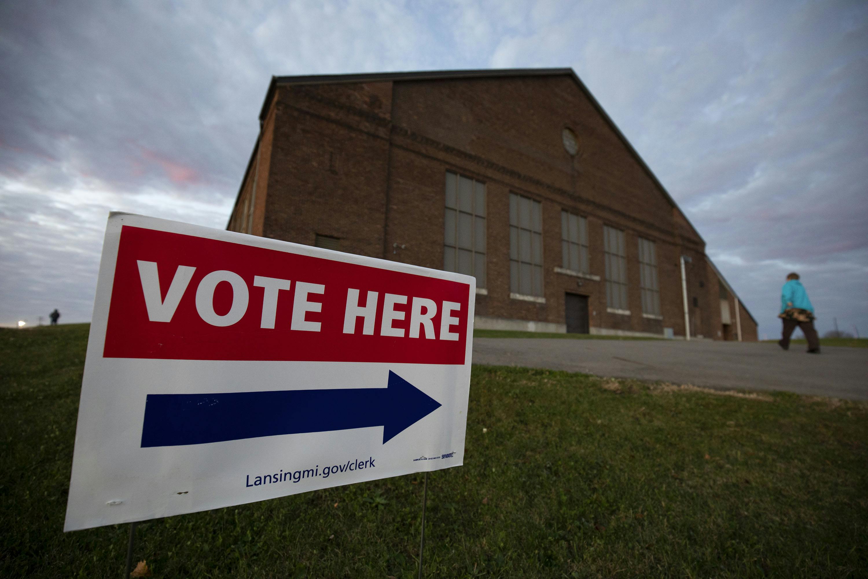 A person walks into a Michigan polling location. 