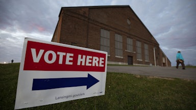 A person walks into a Michigan polling location.