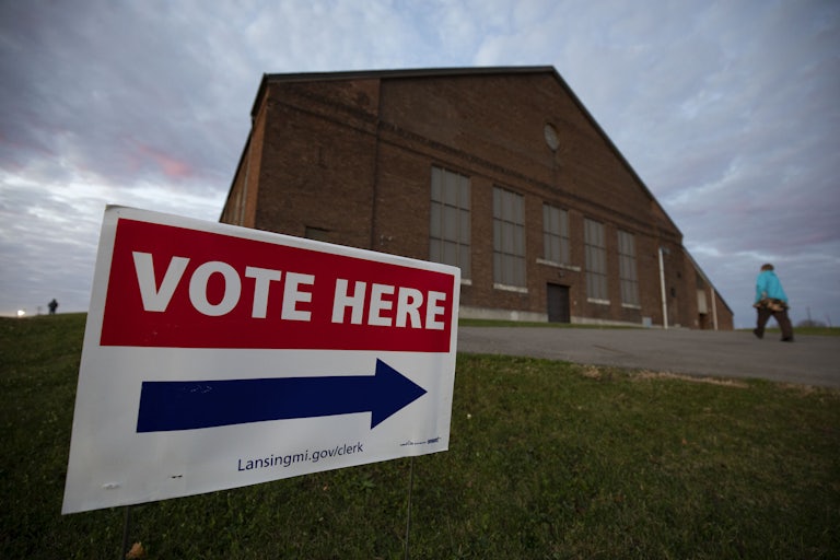 A person walks into a Michigan polling location.