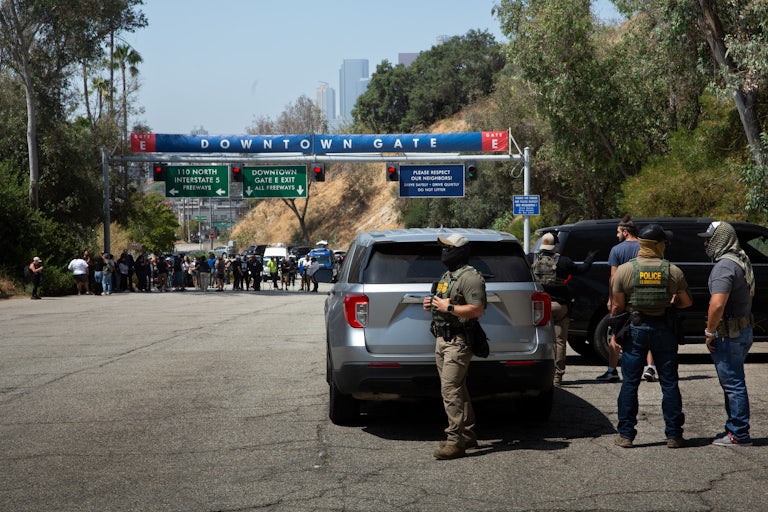 ICE officials stand outside the Dodgers Stadium in Los Angeles, California.
