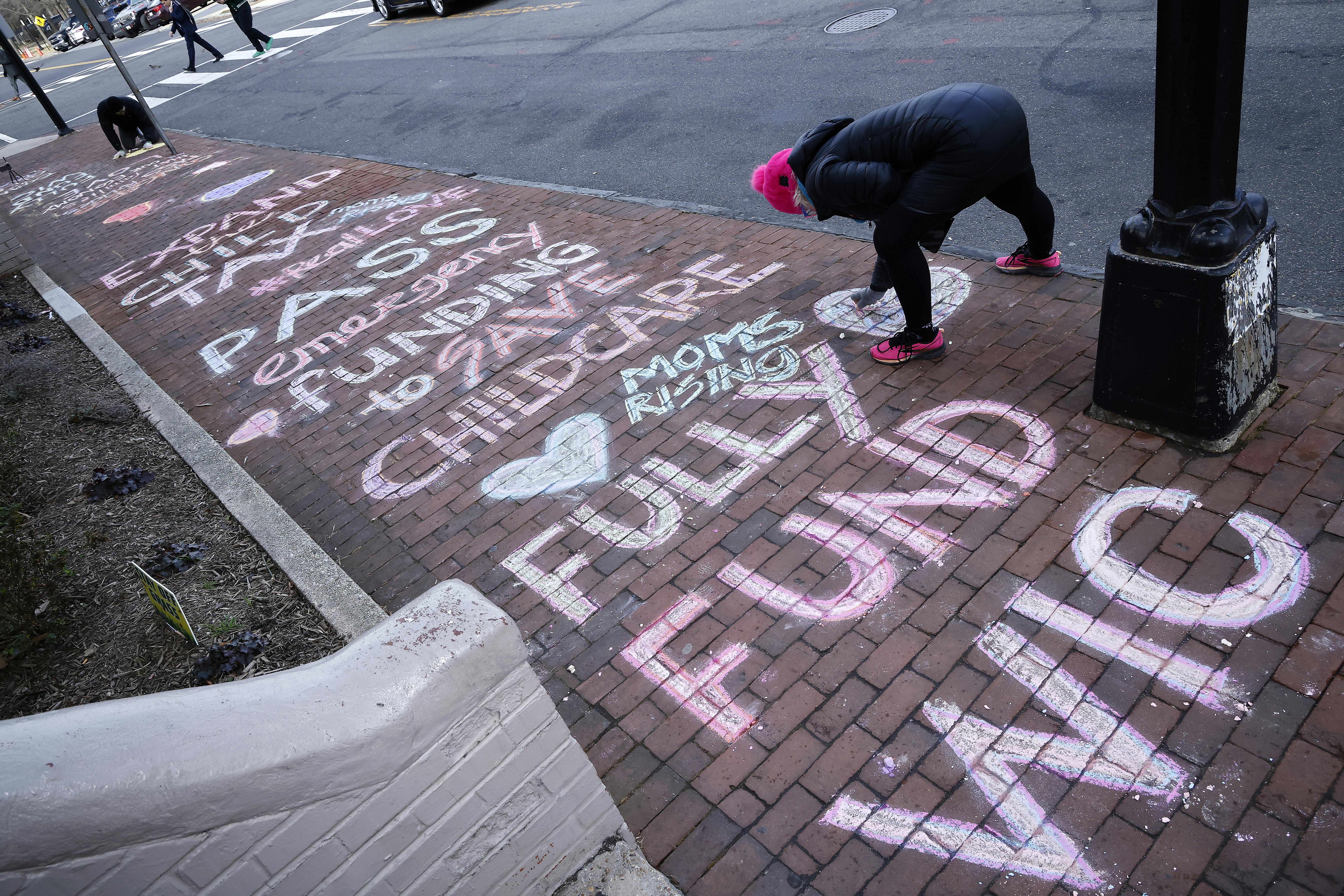 MomsRising sidewalk art asks lawmakers to expand the Child Tax Credit.