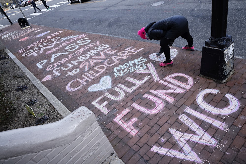 MomsRising sidewalk art asks lawmakers to expand the Child Tax Credit.