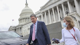 West Virginia Senator Joe Manchin walks down the steps of the U.S. Capitol