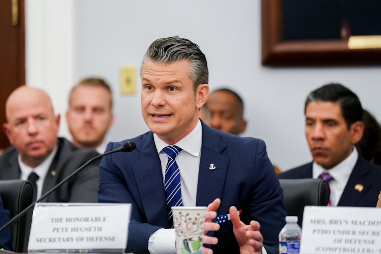Defense Secretary Pete Hegseth speaks animatedly while testifying in Congress.