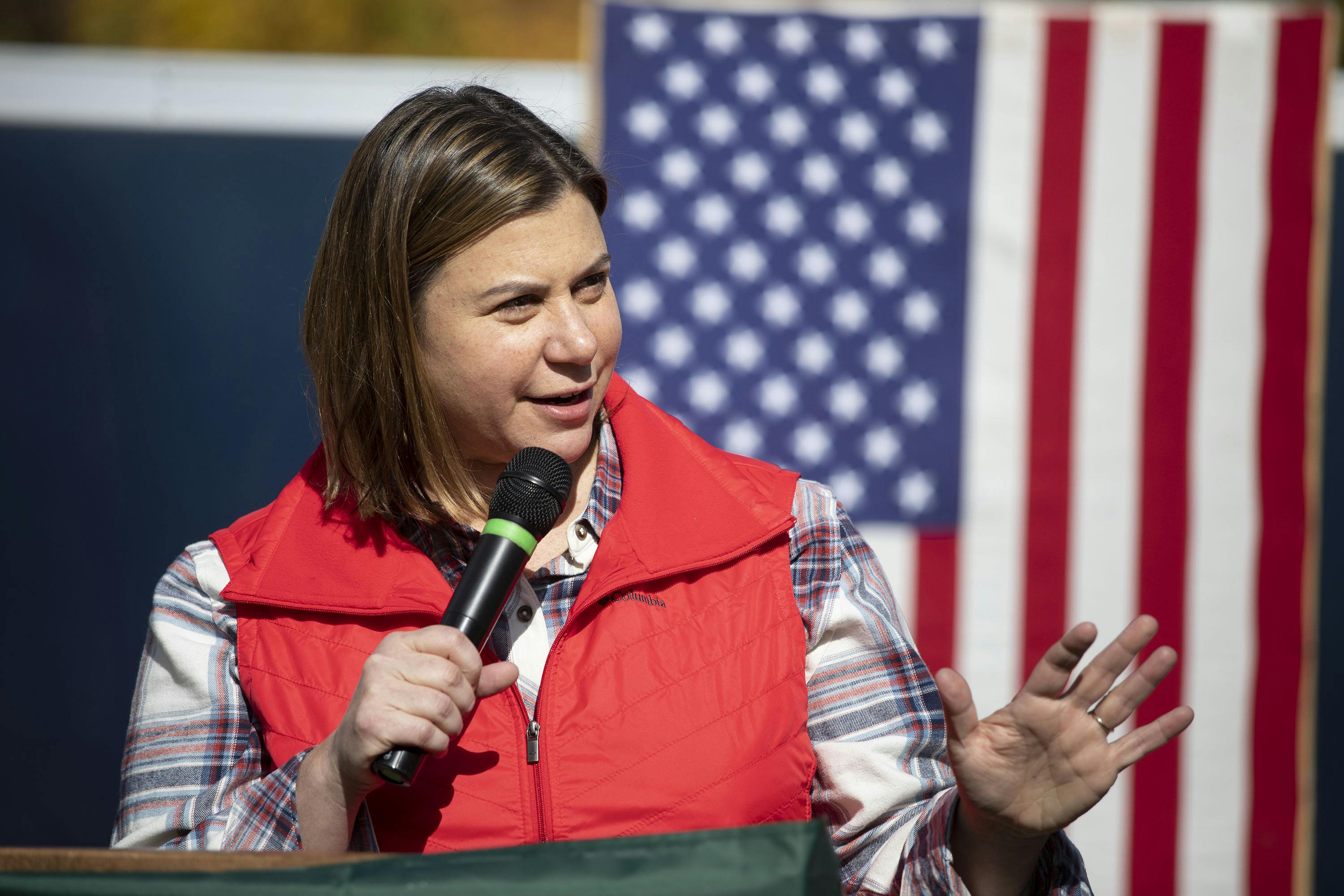 Elisa Slotkin speaks into a microphone at a campaign event