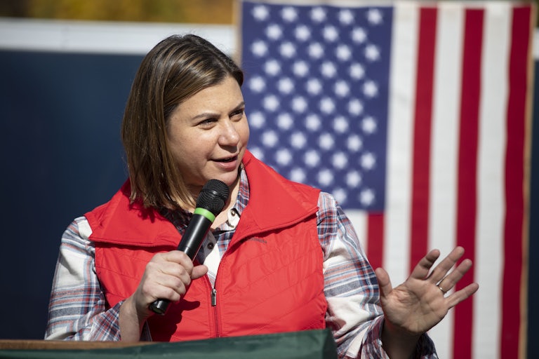 Elisa Slotkin speaks into a microphone at a campaign event