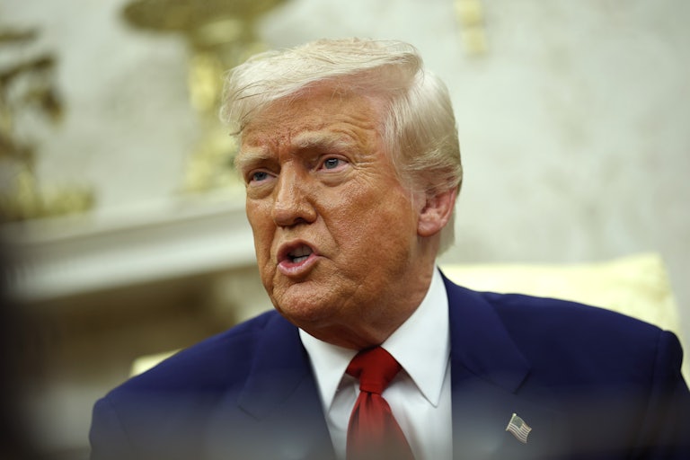 Donald Trump speaks angrily while seated in the Oval Office of the White House.