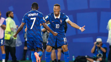 Kylian Mbappé and Ousmane Dembélé celebrate a goal against Iraq at the 2026 World Cup.