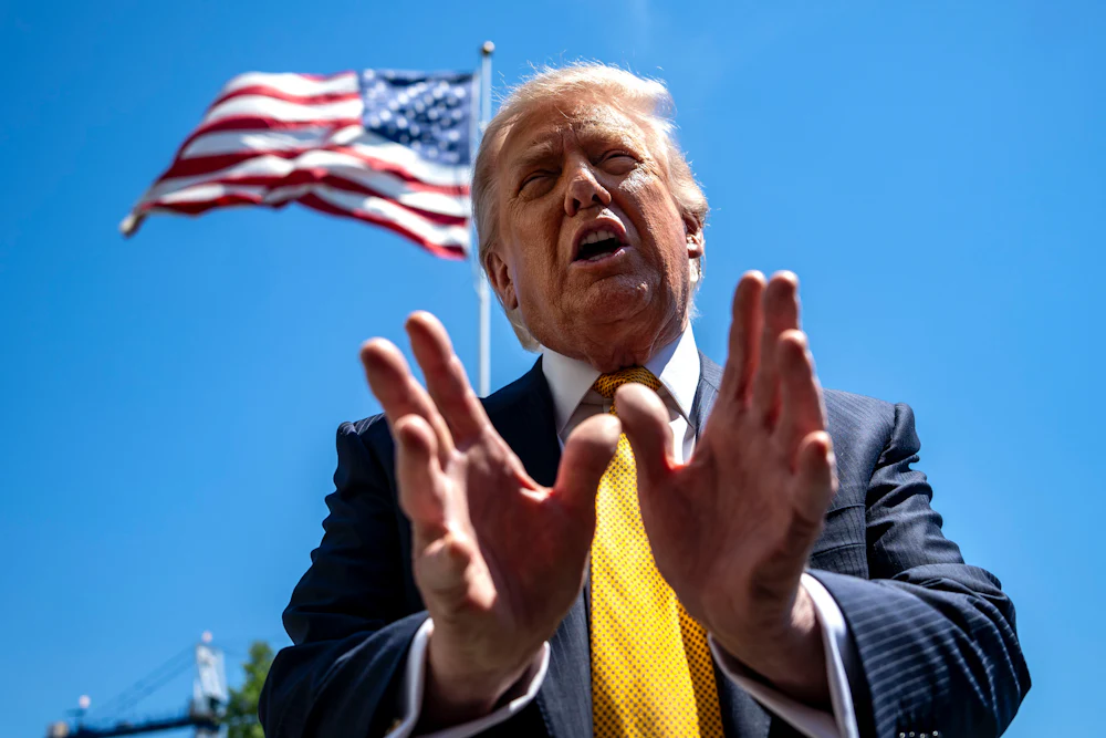 Donald Trump speaks to members of the media on the South Lawn of the White House.