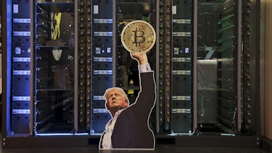 A cutout of US President Donald Trump holding a Bitcoin is displayed on a group of servers during The Bitcoin Conference at The Venetian Las Vegas in Las Vegas, Nevada.