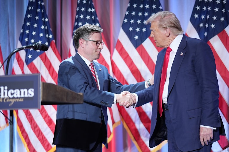 Mike Johnson and Donald Trump shake hands