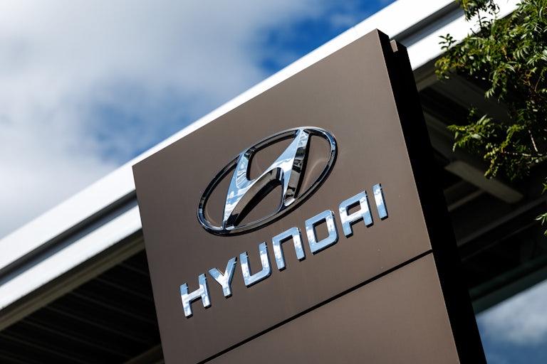 The logo for the car company Hyundai.