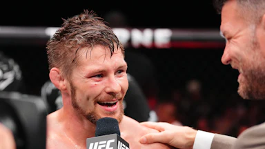 UFC fighter Bryce Mitchell smiles and speaks to a reporter after a match