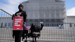 Activists and participants gather in front of the Supreme Court of the United States during Supreme Court re-argument of Louisiana v. Callais.