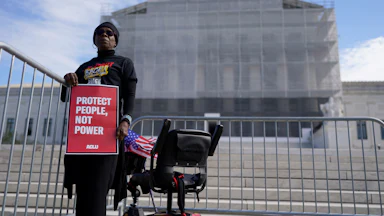 Activists and participants gather in front of the Supreme Court of the United States during Supreme Court re-argument of Louisiana v. Callais.