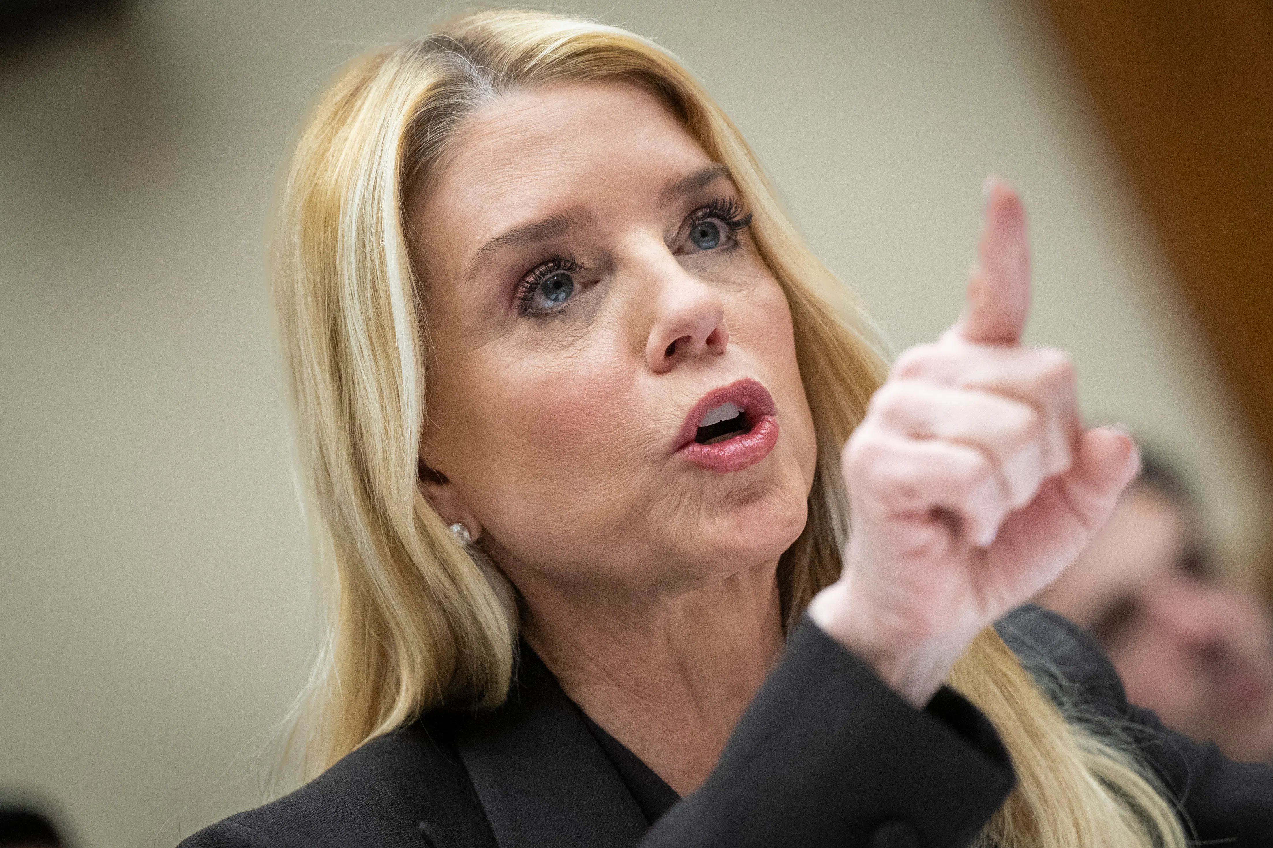 Ex-Attorney General Pam Bondi points while speaking during a House committee hearing