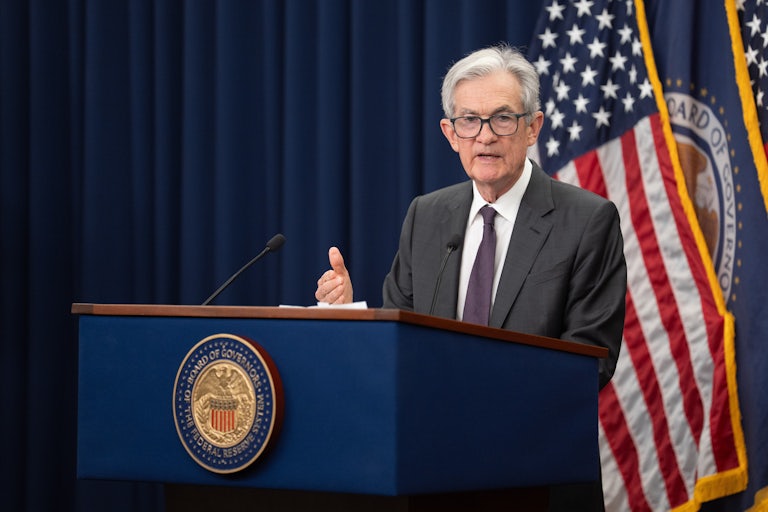 Federal Reserve Chair Jerome Powell gestures while speaking at a podium