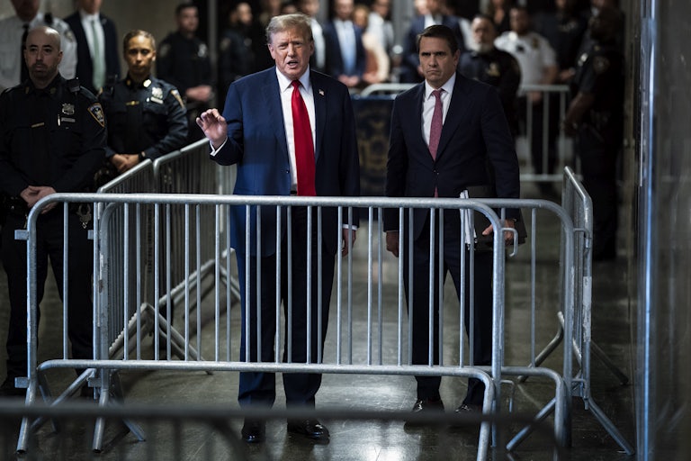 Donald Trump gestures while he speaks