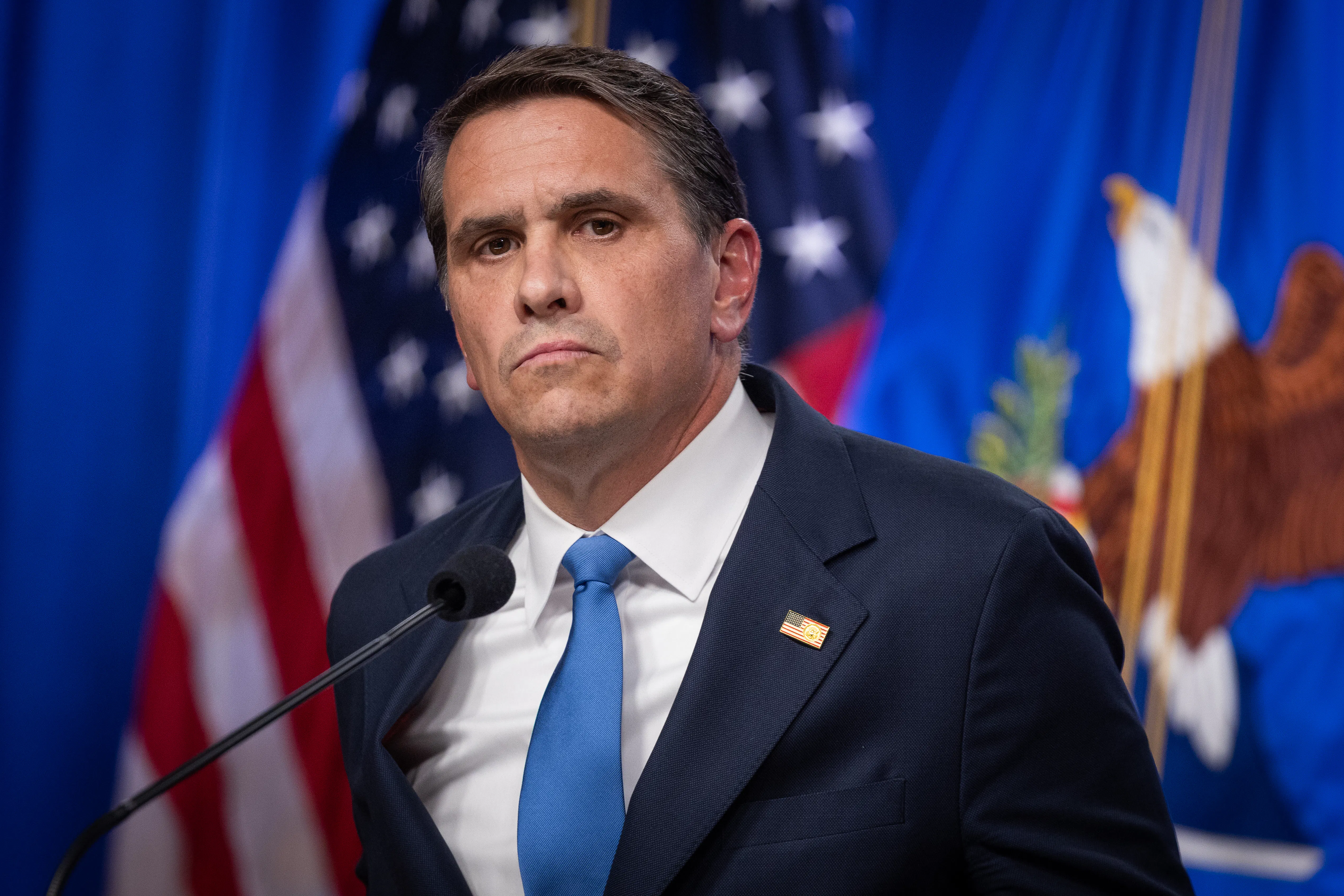 Acting Attorney General Todd Blanche stands at a podium