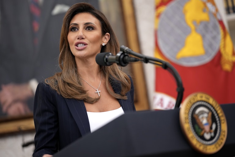 Alina Habba speaks at the presidential podium in the White House.