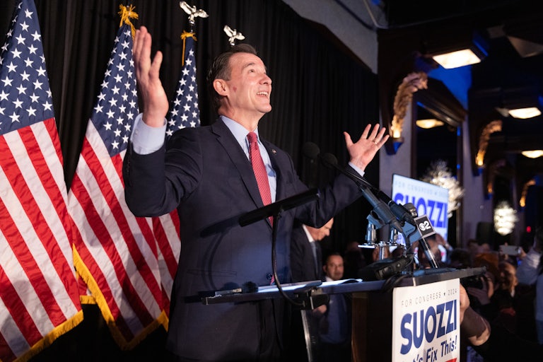 Tom Suozzi celebrates during an election night watch party.