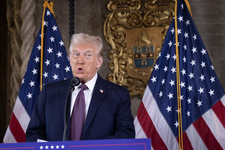 Donald Trump speaks at a podium