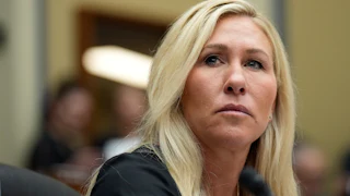 Marjorie Taylor Greene stares