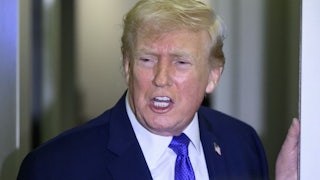 Donald Trump stands while speaking vehemently