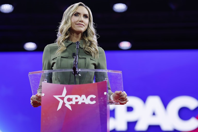 Lara Trump speaking at a CPAC lectern. The background also reads CPAC.