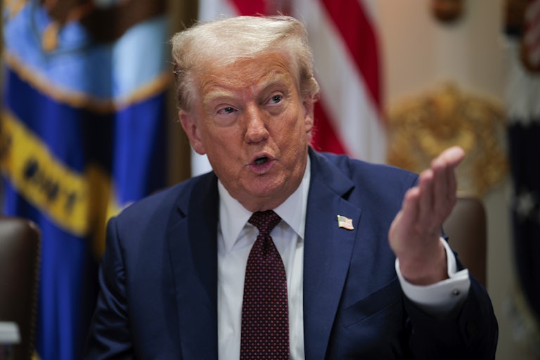 Donald Trump speaks and points a hand