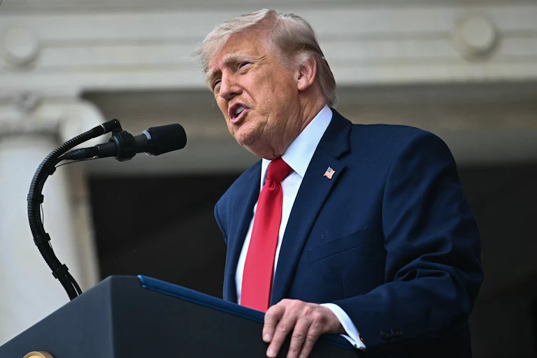 Donald Trump speaks at a podium