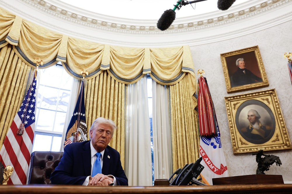 Donald Trump sits in the Oval Office of the White House.